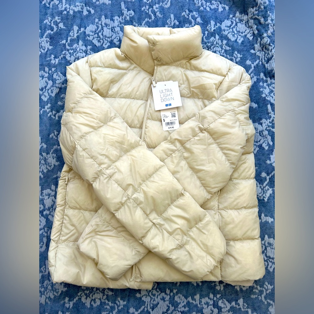 Uniqlo ultra light down jacket in cream - brand new with tags